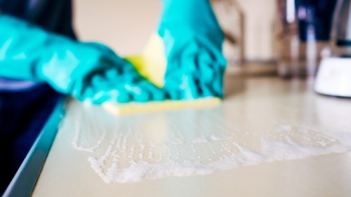Step-by-step mattress cleaning process in a bedroom
